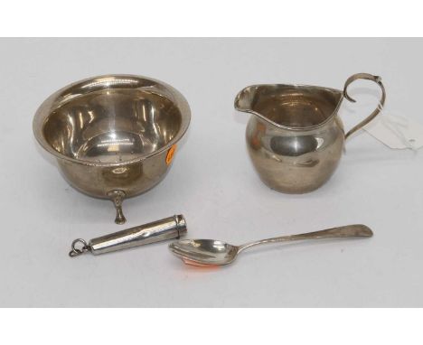 Goerge V silver sugar bowl with plain undecorated form on three cast poured feet, together with a George V silver helmet shap