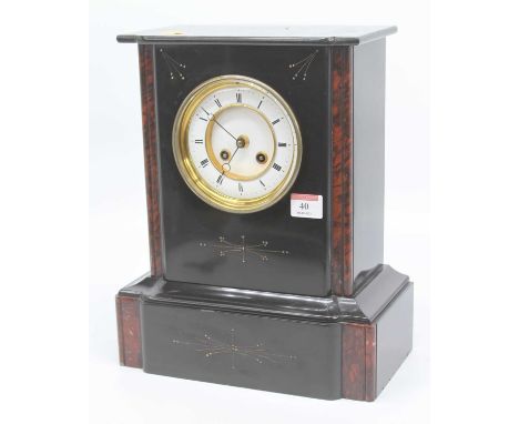 A Victorian black slate mantel clock, the enamel chapter ring showing Roman numerals, the 8 day movement striking on a bell, 