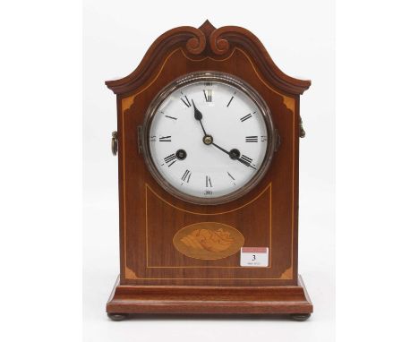 An early 20th century mahogany and box wood strung mantel clock, the enamel dial showing Roman numerals, the 8 day movement s