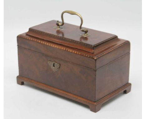 A George III mahogany and barber pole strung triple compartment tea caddy, the cavetto moulded lid having swan neck handle, a
