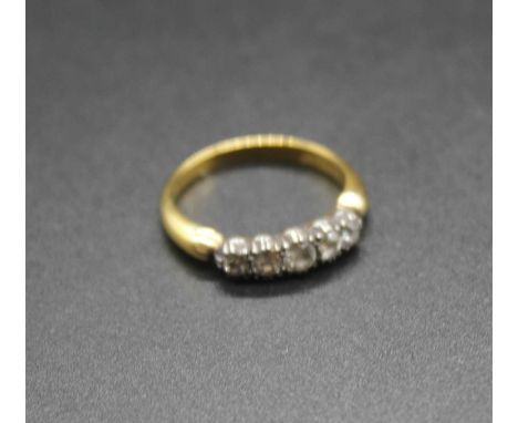 An 18ct gold diamond five stone ring, size L, 3g