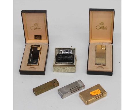 A Du Pont de Paris textured gold plated cased pocket cigarette lighter numbered R4DL20, together with various other pocket ci