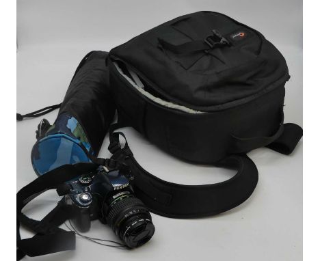 A Pentax digital camera with lenses, cased; together with a tripod  