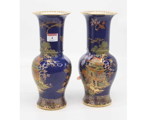 A pair of Carlton ware blue lustre vases, each of baluster form, gilt and enamel decorated with a pagoda, height 28cm