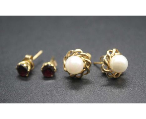A pair of modern 9ct gold and cultured pearl set ear studs; together with a pair of yellow metal garnet set ear studs (2)