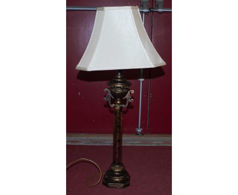 A modern gilt table lamp, having a cream shade, height 85cm