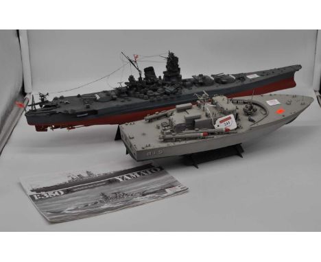 A Tamiya 1:350 scale model of the Yamato Japanese battleship, 74cm, together with another similar