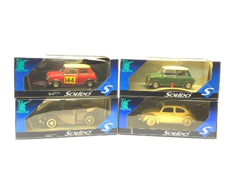 Four Solido Prestige large scale die-cast models comprising V.W. Coccinelle, V.W. Beetle, Mini Cooper S 1964 and another Mini