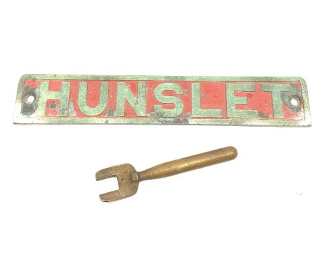 Channel tunnel - engine brass nameplate 'Hunslet', with traces of red paint  L43cm; and brass operating handle for an adhesio