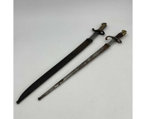 A French M1874 Gras sword bayonet, two piece wooden grip, housed in steel scabbard, foundry marks to ricasso, spine marked Mr