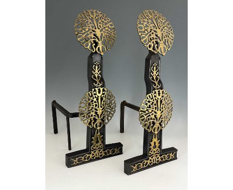 Manner of Ernest Gimson, a pair of Arts &amp; Crafts brass and iron fire dogs, of 17th Century design, double pierced brass r