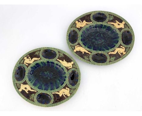 Two Minton type Majolica Fecundity dishes, oval form, after the Renaissance Palissy original, modelled in relief with the Cla