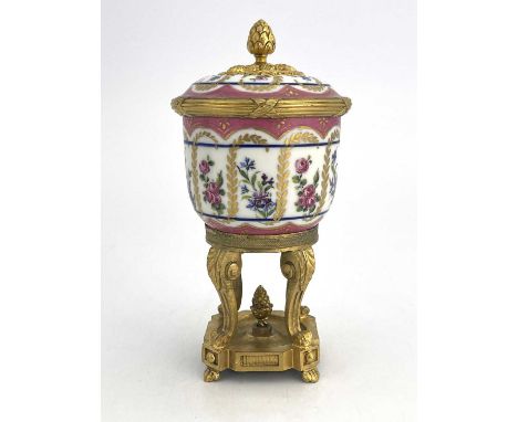 A Paris porcelain and ormolu mounted potpourri vase and cover, pink ground beaker bowl with gilt fronts and alternating rose 