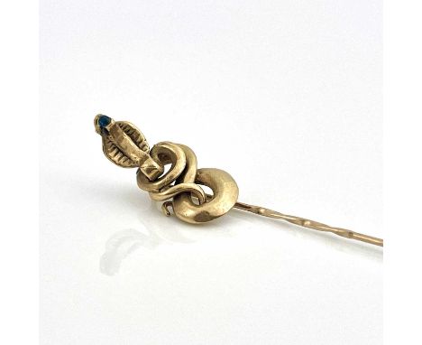 A 9ct gold stick or tie pin with coiled cobra finial, set sapphire, hallmarked, 3.7g