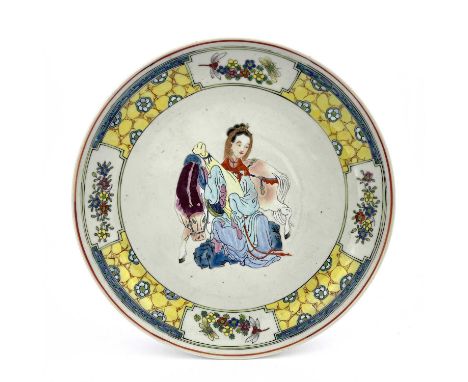 A Chinese famille jaune dish, the central image of Wang Zhaojun in polychrome enamel within a yellow ground, cracked ice and 