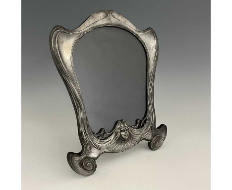 Orivit, a Jugendstil pewter frame, model 2280, circa 1905, ogee bracketed shield form, modelled in relief with a maiden's hea