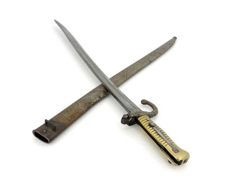 A Dutch 1873 yataghan sword bayonet, brass grip and quillon, housed in steel scabbard, ricasso marked P. Stevens Maastricht a