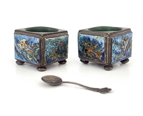 A pair of Arts and Crafts enamelled and silver plated salt cellars, circa 1910, cuboid form each with four aquatic panels, in