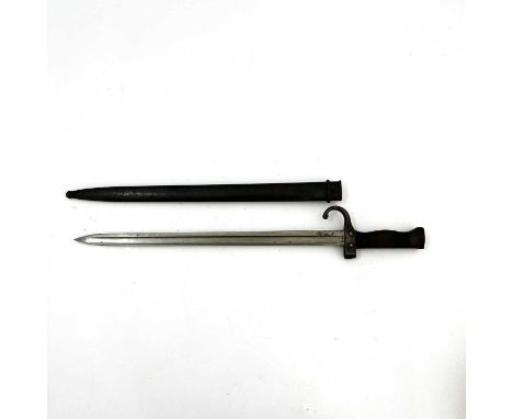 A late 19th century French M1892 Mannlicher Berthier sword bayonet, two piece wooden grip and quillon, housed in steel scabba