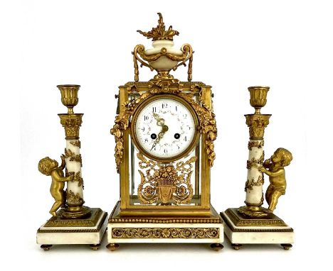 Leroy, Paris, a late 19th Century French clock garniture, gilt metal four-glass case with white marble urn finial, extensive 