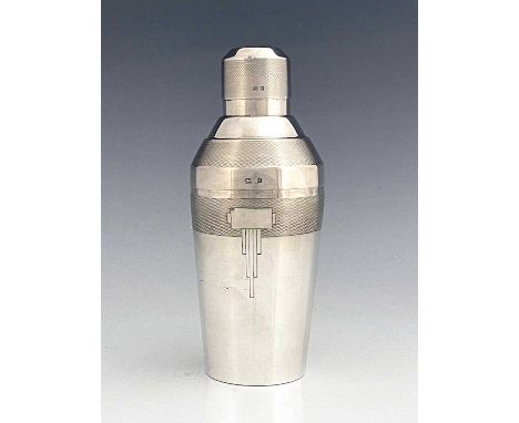 An Art Deco silver cocktail shaker, Elkington and Co., Birmingham 1936, conical form with stepped shoulder, barleycorn engine