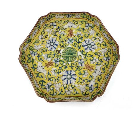 A Chinese famille jaune tray, hexagonal form, decorated in the Qianlong style with lotus flowers and bats on a foliate scroll