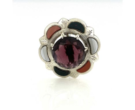 A silver and Scottish hardstone set thistle hat pin, the central amethyst within a chased frame of specimen agate and bloodst