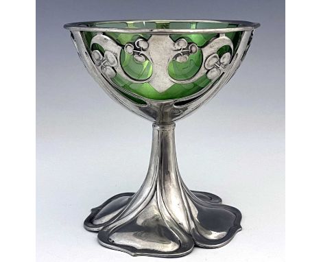 Archibald Knox for Liberty and Co., a Tudric Arts and Crafts pewter and green glass pedestal bowl, model 0955, the reticulate