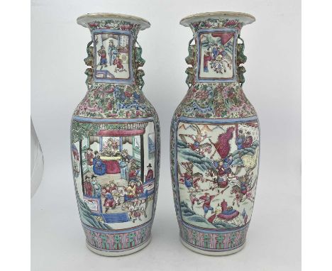 A pair of Chinese porcelain vases, 19th Century, Guangxu period, 1875-1908, profusely decorated in mirror image with court sc