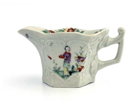 A Worcester hexagonal cream boat, circa 1752-54, od Wigornia type, relief moulded foliate scroll cartouches, painted with Man