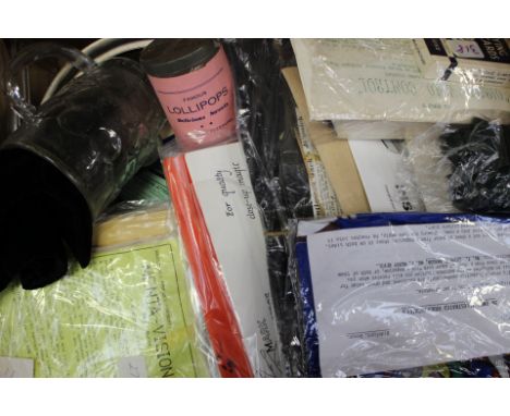 Collection of vintage magic tricks, to include spring snakes, various cards, trick glass, Al Koran's "Direct Mind Control", a