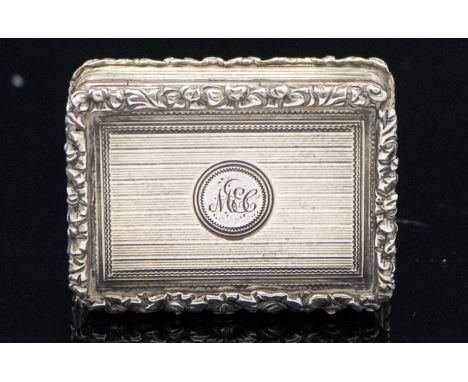 A Victorian silver vinaigrette, engine turned pinstripe within cast foliate relief borders and a gilt sunflower grille, Edwar
