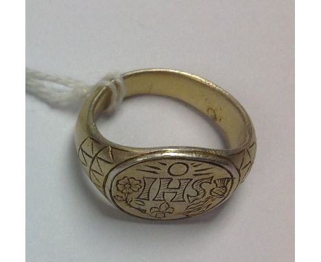 A 17th Century silver gilt ring Charles 1st mourning ring, JHS Christogram with thistle and rose to the side, fleur de lys to