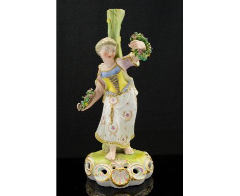 A Derby Stevenson and Hancock figural candlestick, modelled as a girl with floral wreaths, puce mark, 25cm high