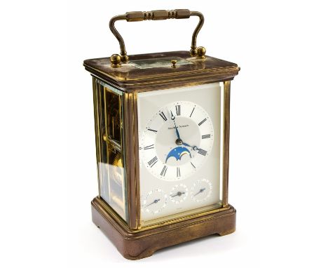 A gilt brass carriage clock, Swiss movement, signed MAtthew Norman to the dial, moonphase and three subsidiary dials, with re