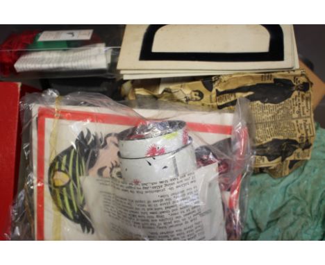 A box of magic tricks to include, 'deluxe fire bowl', card tricks, 'Cylindra', 'Jet Silk Vanish', 'blend silk', rubber eggs, 