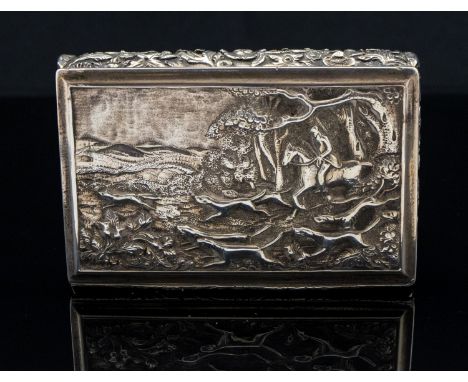 Hunting interest, a George IV silver snuff box, cast in relief with a hunting scene of huntsman and hounds in romantic landsc