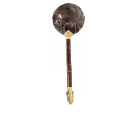 Ø A 19TH CENTURY SAILORWORK COCONUT SHELL WATER LADLE the bowl carved with leaf design, heart-shaped marine ivory handle moun