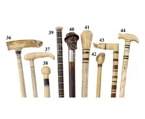 Ø A 19TH CENTURY SAILORWORK WHALEBONE WALKING STICK the plain tapering shaft to marine ivory handle carved with the head of B