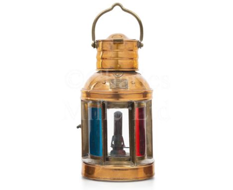 A COPPER AND BRASS LAUNCH LAMP, CIRCA 1890 the clear glass front panel flanked by red and green filters with oil burner assem