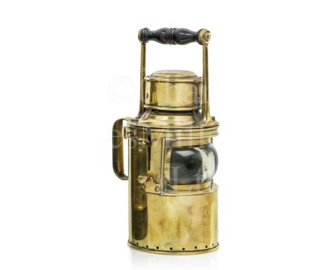 A TRINITY HOUSE PATTERN SIGNAL LAMP, CIRCA 1890 constructed in brass with bull's eye lens, side shutter, fixed rear and top h