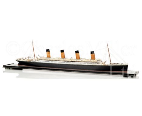 A FINE 1:32 SCALE WATERLINE MODEL OF R.M.S. OLYMPIC AS BUILT IN 1911 modelled by Charles Longbotham, the laminated and carved