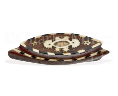 Ø AN INLAID WOODEN SNUFF BOX IN THE FORM OF A SHIP, CIRCA 1870 carved in oak as a ram-bowed battleship with bone and ebony co