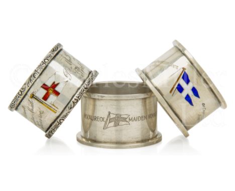 THREE SOUVENIR ENAMEL AND SILVER NAPKIN RINGS comprising Elder Dempster Line 1925; Royal Mail Lines (maiden voyage Port Kings