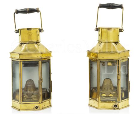 A PAIR OF BULKHEAD ENGINE ROOM OIL LAMPS, CIRCA 1914 with clear glass panels with hinged access to right to burner with key a