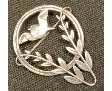 Arno Malinowski for Georg Jensen - a Danish silver brooch, no. 258, openwork circlet enclosing a bird and foliage, impressed 