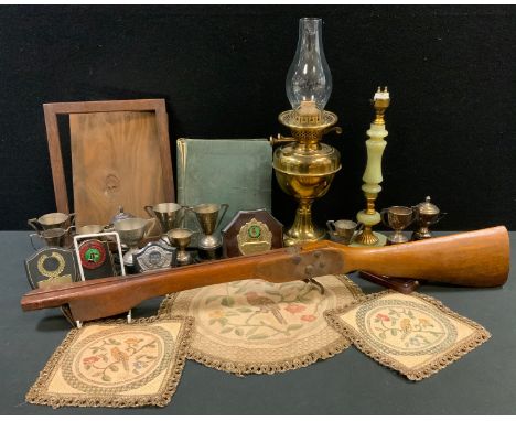 A School Boy stamp album;  a crossbow stock; an oil lamp;  an onyx side light; plated trophy cups'  etc 