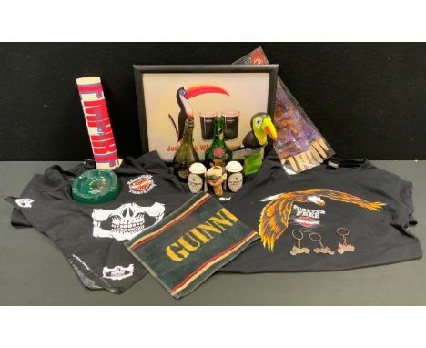 A Guinness Just Think Toucan Do, frame;  a Guinness beer mat;  a pair of salt and pepper pots;  a Harley Davidson tea shirt; 