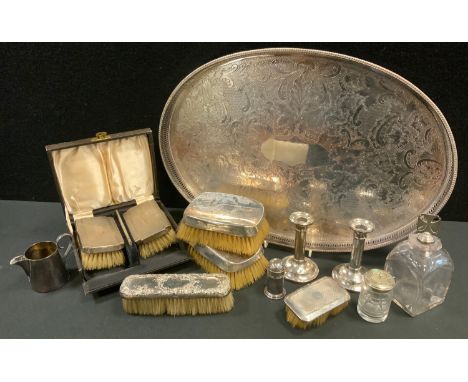 A pair of silver backed dressing table brushes;  others;    a pair of silver  taper sticks;  a plated gallery tray;  etc 