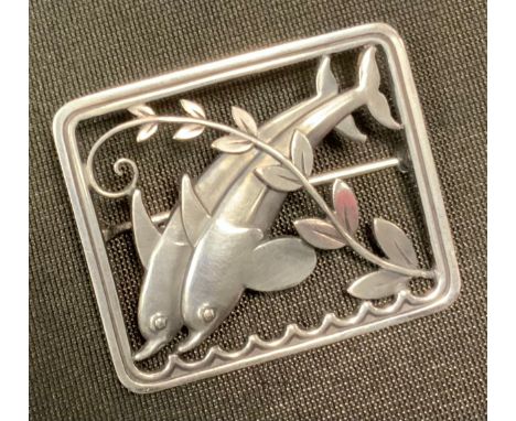 Arno Malinowsky for Georg Jensen - a Danish sterling silver brooch two leaping dolphins, design no. 251, marked Georg Jensen 